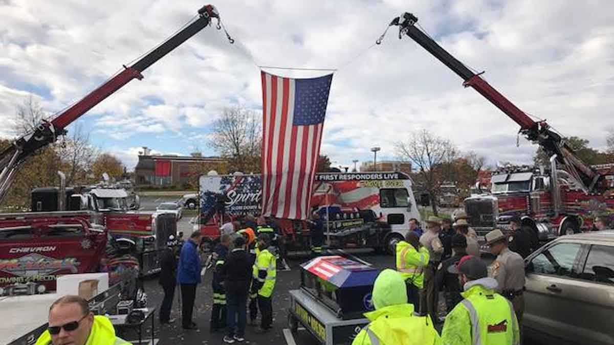 Spirit Ride Trucks Hoisting Flag